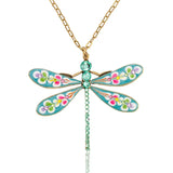 The Brite Burst Floral Bouquet Large Dragonfly Crystal Necklace by Anne Koplik Designs, Inc. features vibrant enamel wings, colorful floral accents, and green crystals for a bold boho statement.
