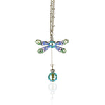 The Small Enamel/Crystal Dragonfly w/Drop Necklace by Anne Koplik Designs, Inc. features hand-enameled wings with blue, green, and purple crystals plus a dangling blue gem—an exquisite piece shown on a white background.
