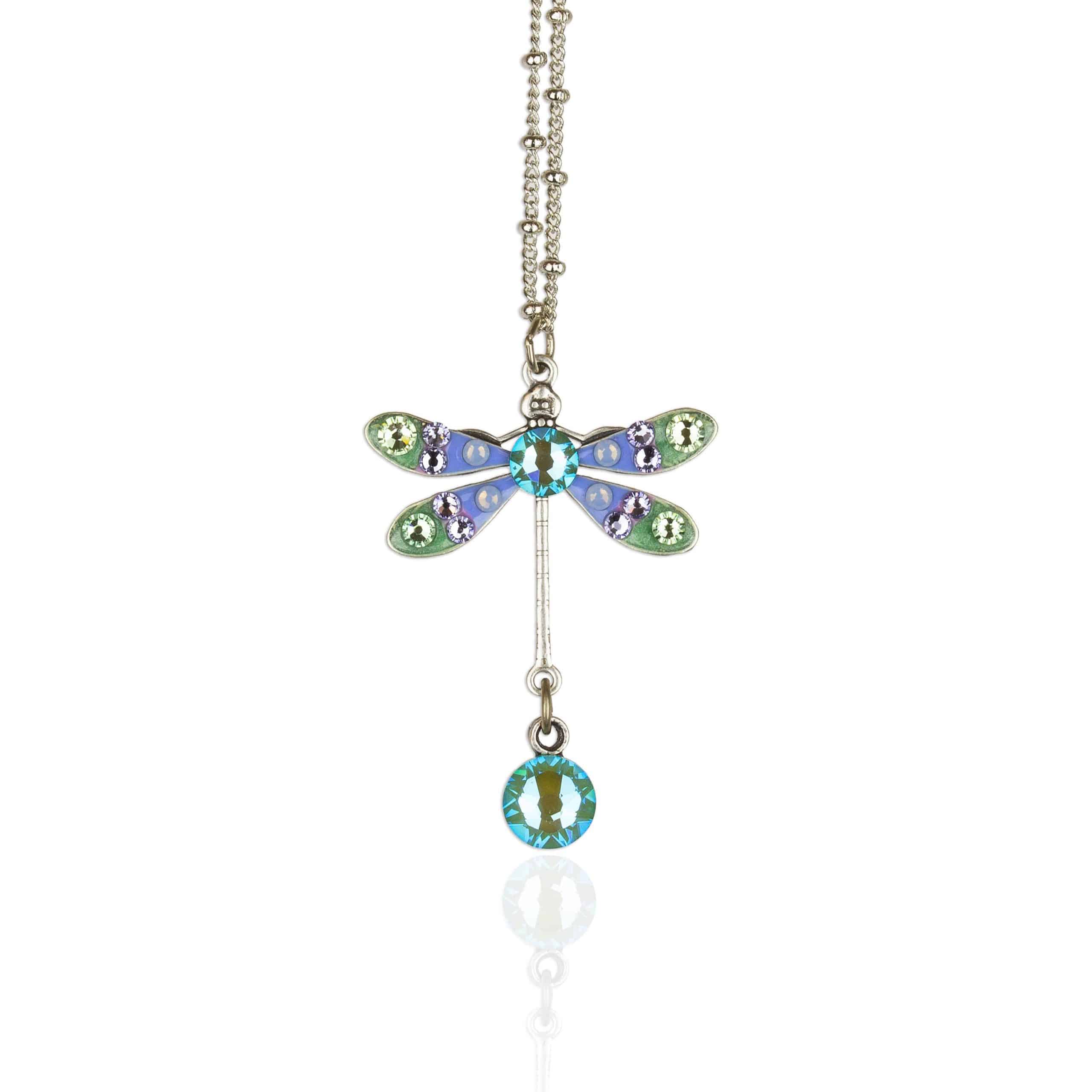The Small Enamel/Crystal Dragonfly w/Drop Necklace by Anne Koplik Designs, Inc. features hand-enameled wings with blue, green, and purple crystals plus a dangling blue gem—an exquisite piece shown on a white background.