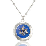 The Anne Koplik Designs Unity Star of David Blue Crystal Judaica Locket Necklace features a silver-plated round pendant with a jeweled Star of David on a blue background.