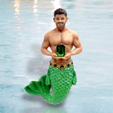 The December Diamonds May Birthstone-Emerald Merman features a hand-painted figurine with a green glittery tail, jeweled belt, and a large emerald gemstone, making it a perfect ornament for May birthdays.