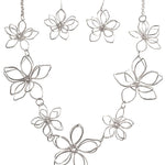 The A-Train Silver 3D Flowers Necklace Set features multiple wire-formed openwork blooms linked together, crafted from mixed jeweler’s metals for a lightweight and elegant floral look.