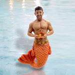 The November Birthstone - Citrine Merman by December Diamonds features a muscular merman with a glittery orange fish tail and short brown hair holding a starfish—a unique ornament for mermaid enthusiasts.