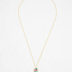 Davy Rectangle Two Layers Tropic Magenta Necklace by Holly Yashi features a rectangular pendant with an abstract, multicolored geometric design. This hand-painted piece stands out beautifully against a white, textured background.