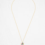 Davy Rectangle Two Layers Tropic Magenta Necklace by Holly Yashi features a rectangular pendant with an abstract, multicolored geometric design. This hand-painted piece stands out beautifully against a white, textured background.
