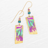 The Davy Rectangles Two Layers - Tropic Magenta Earrings by Holly Yashi feature vibrant purple, green, and teal geometric patterns meticulously crafted as hand-painted earrings. Accented with small teal and gold beads, these rectangular gold earrings are elegantly displayed on a white textured background.