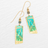 Introducing the Holly Yashi Davy Rectangles Two Layers - Tropic Green Earrings: hand-painted gold earrings featuring layered rectangular shapes with abstract green and teal geometric designs. Each earring is accented with a delicate beaded detail above the rectangles and finished with gold hooks, beautifully displayed on a white textured background. These striking accessories are perfect for any occasion.