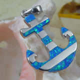 The Jewelry Network Caribbean Opal Anchor w/ Segments-Pendant ONLY is crafted from 925 sterling silver with blue opal inlays, shown resting against a pale seashell with a blurred yellow object in the background.