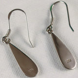Jewelry Network’s Caribbean Opal Teardrop 4 Segment Earrings feature silver 925-stamped teardrop dangles with hook backs, shown on a white textured surface.