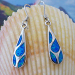 Caribbean Opal Teardrop 4 Segment Earrings by Jewelry Network feature blue opal inlays set in 925 sterling silver, shown against a light seashell background.