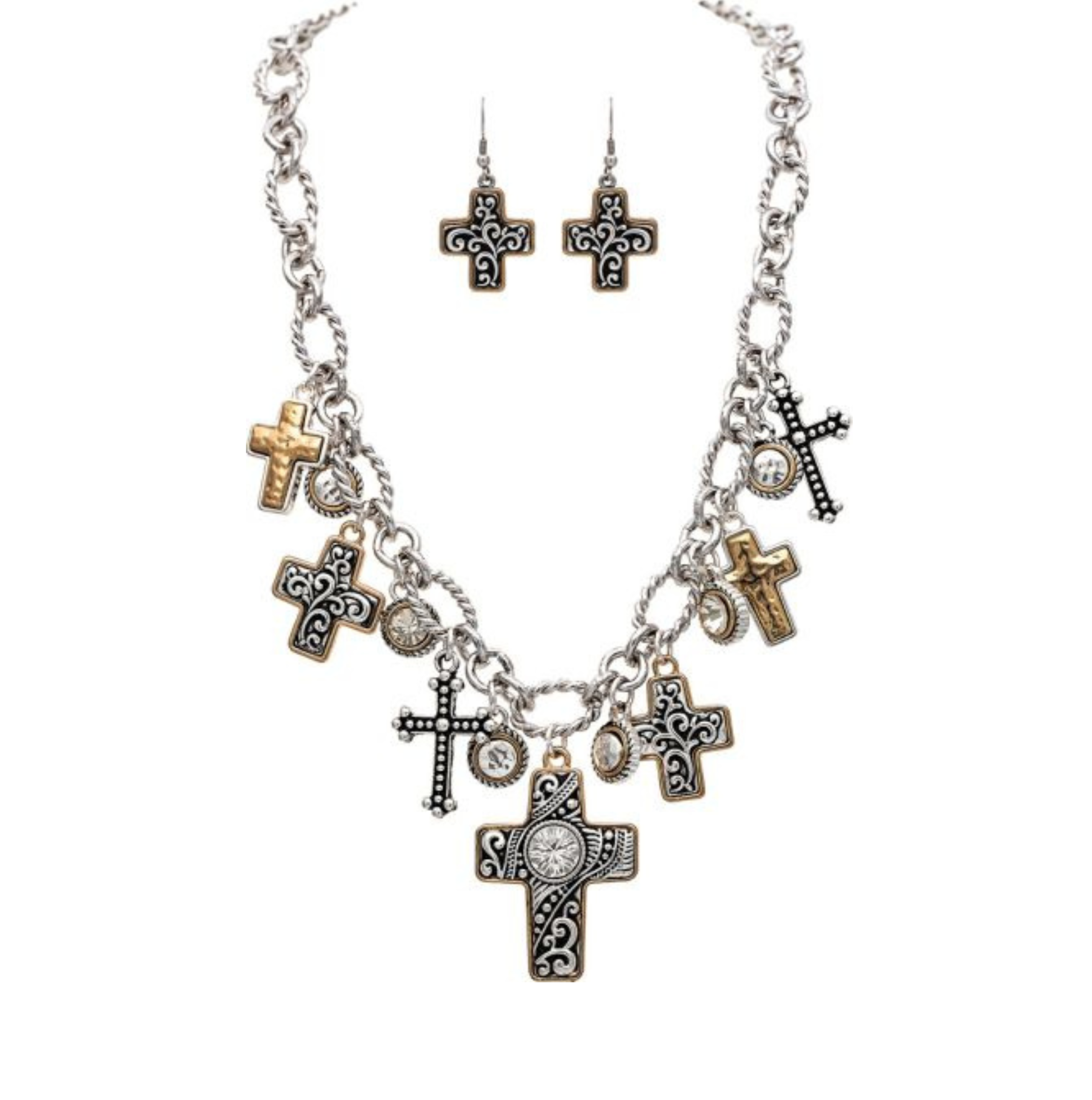 Introducing the A-Train Two Tone Oxidized Swirl and Scroll Cross Charms Necklace Set, featuring a silver chain adorned with intricately designed cross charms in gold and silver finishes. The set includes matching cross earrings with striking black and white details, blending classic elegance with contemporary style reminiscent of oxidized swirl jewelry.