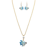Elevate your style with the A-Train Gold Ceramic Fish Beads Necklace Set, which includes a striking necklace and matching earrings. Each piece features a blue and white fish-shaped pendant with wavy green accents and a delicate pearl detail, all elegantly displayed on a crisp white background.