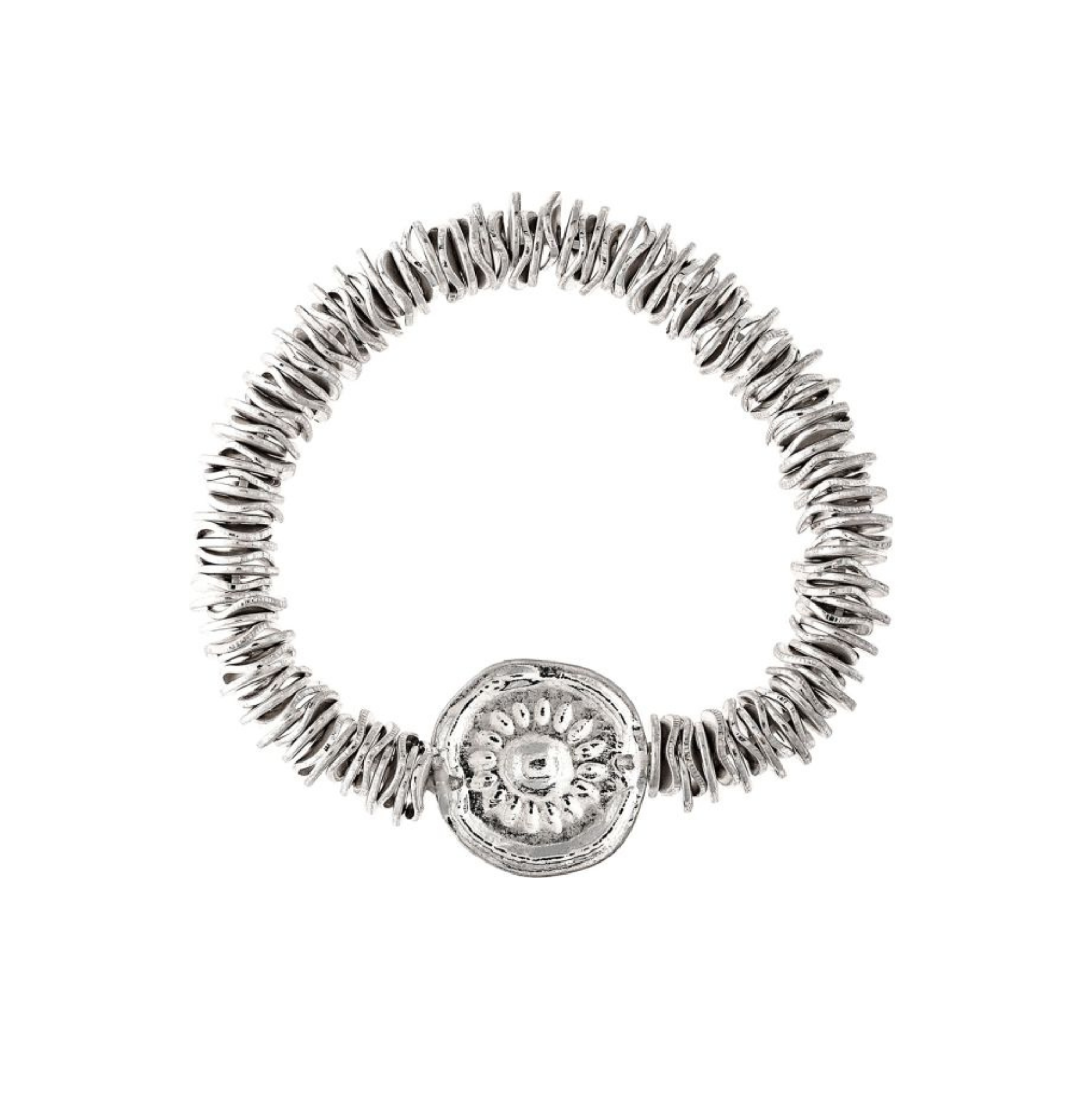 Introducing the A-Train Silver Disc Beads Sunflower Medallion Bracelet, an elegant piece adorned with multiple small, ring-shaped silver disc beads and highlighted by a larger, round charm showcasing a stunning sunflower medallion design at its center.