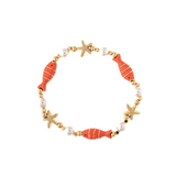 Introducing the Gold Faux Pearl Coral Enamel Fish Bracelet from Benet Store, Inc.—a beaded accessory adorned with orange enamel fish, gold starfish, white faux pearls, and gold beads in a repeating pattern for an elegant, ocean-inspired look.