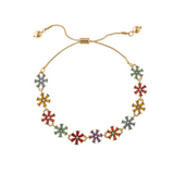 Introducing the A-Train Gold Multicolor Crystal Flower Slide Chain Bracelet—a stunning accessory featuring an adjustable gold chain adorned with flower-shaped charms crafted from vibrant, multicolored crystals, arranged symmetrically around the band. This elegant bracelet adds a lively and sophisticated touch to any ensemble.