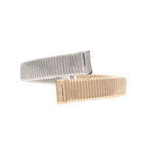Introducing the A-Train Two Tone Crossover Hinged Cuff Bracelet—a modern and minimalist accessory featuring an open-ended, ridged design where a sleek silver side meets a radiant gold side at the front. Each end is finished with a rectangular, textured detail, making this versatile bracelet a striking statement piece.
