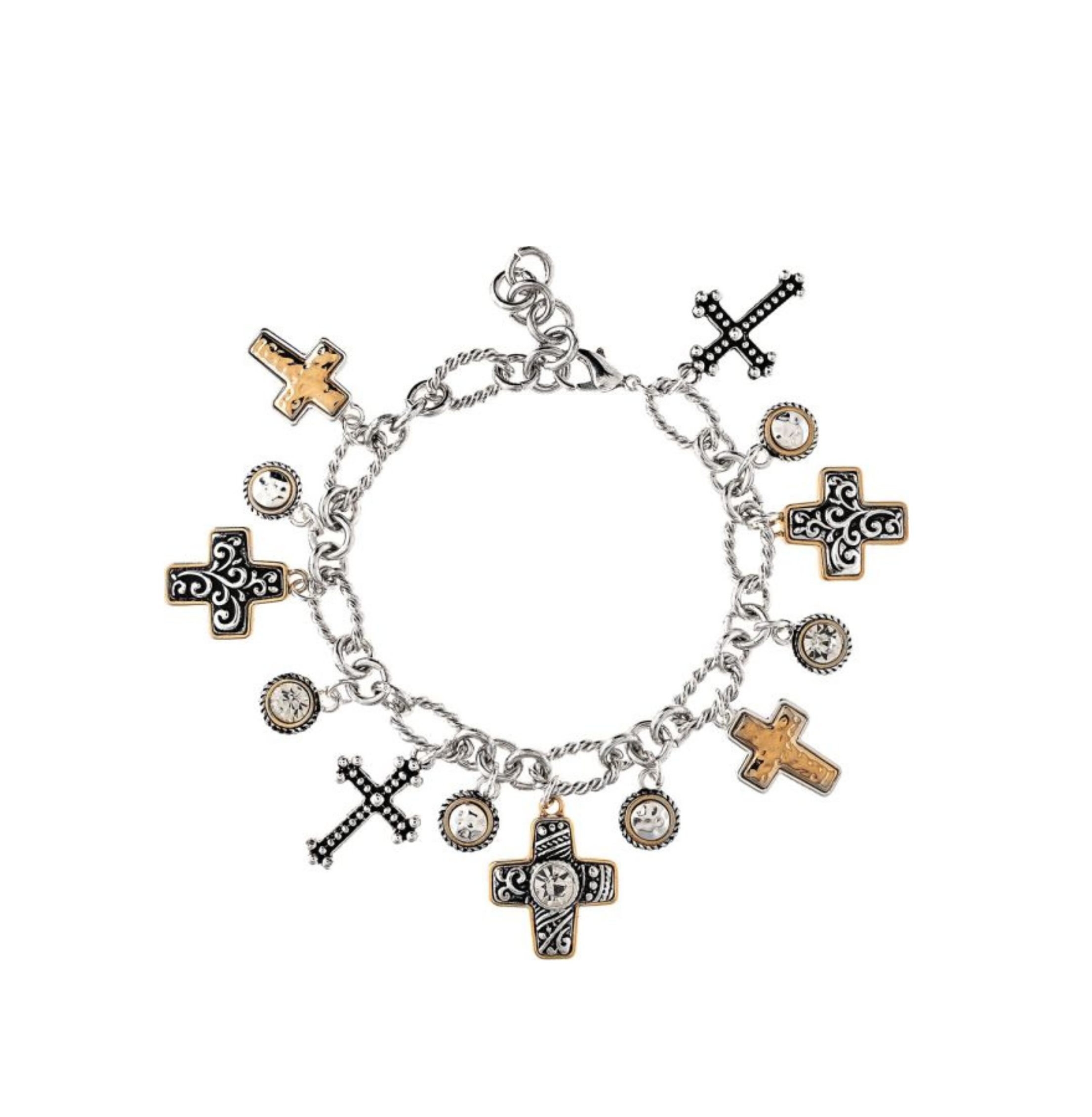Introducing the A-Train Two Tone Oxidized Swirl and Scroll Cross Charms Bracelet, a silver charm bracelet showcasing alternating gold and black cross charms inspired by classic scroll designs. Adorned with small circular charms set with clear stones, this striking piece is beautifully presented against a white background.