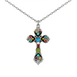Crafted by Firefly, the Medium Multi-Color Cross Necklace features a silver chain and a decorative cross pendant embellished with vibrant red, blue, green, and yellow gemstones—an exquisite example of handmade jewelry from Firefly Jewelry.