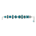 Introducing the La Dolce Vita Light Blue Bracelet by Firefly Jewelry—a stunning handmade piece featuring alternating geometric shapes adorned with blue and turquoise stones and intricate designs, all linked together by delicate silver connectors. Two small blue charms dangle from the clasp on the right end, making this Fair Trade accessory from Firefly a uniquely beautiful addition to your jewelry collection.