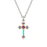 The Dainty Cross Multi-Color necklace by Firefly features a silver chain and a pendant adorned with vibrant gemstones in red, purple, yellow, and turquoise accents. Handmade in Guatemala by Firefly Jewelry, the pendant showcases a symmetrical, ornate design for a unique and colorful flair.