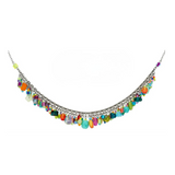 The Confetti Multi-Color Necklace—Limited Edition by Firefly is a beautiful silver necklace adorned with small, colorful gemstone and bead charms along the chain, creating a vibrant and festive look. This stunning piece of handmade jewelry from Firefly adds a playful burst of color to any outfit.