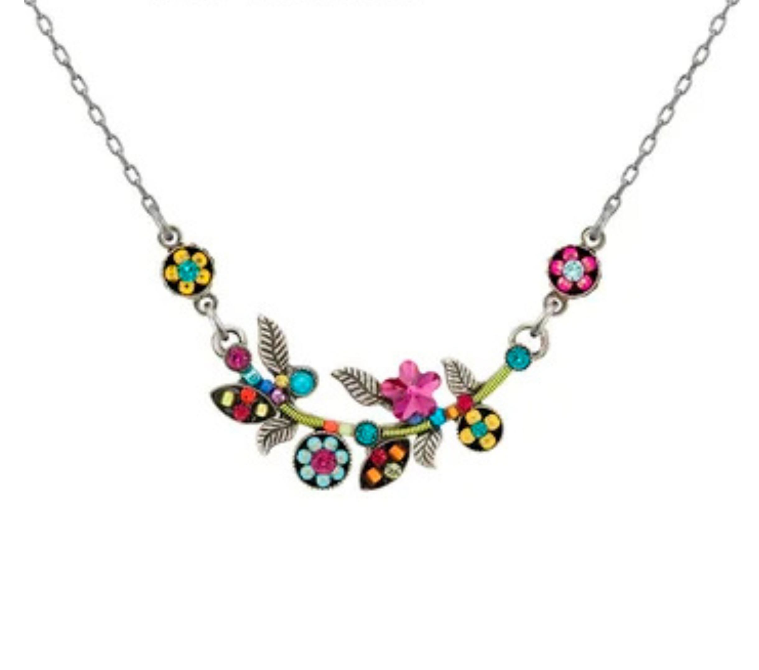 The Scalloped Multi-Color Flower Necklace from Firefly features a silver chain adorned with vibrant pink, blue, and yellow flowers alongside green leaves, all intricately arranged in decorative floral and leaf patterns. This stunning piece highlights Firefly’s signature artisanal craftsmanship.