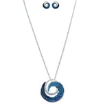 The A-Train Silver Textured Blue Curl Pendant Necklace Set features a round blue curl pendant and matching blue and silver swirl stud earrings, elegantly displayed on a white background.