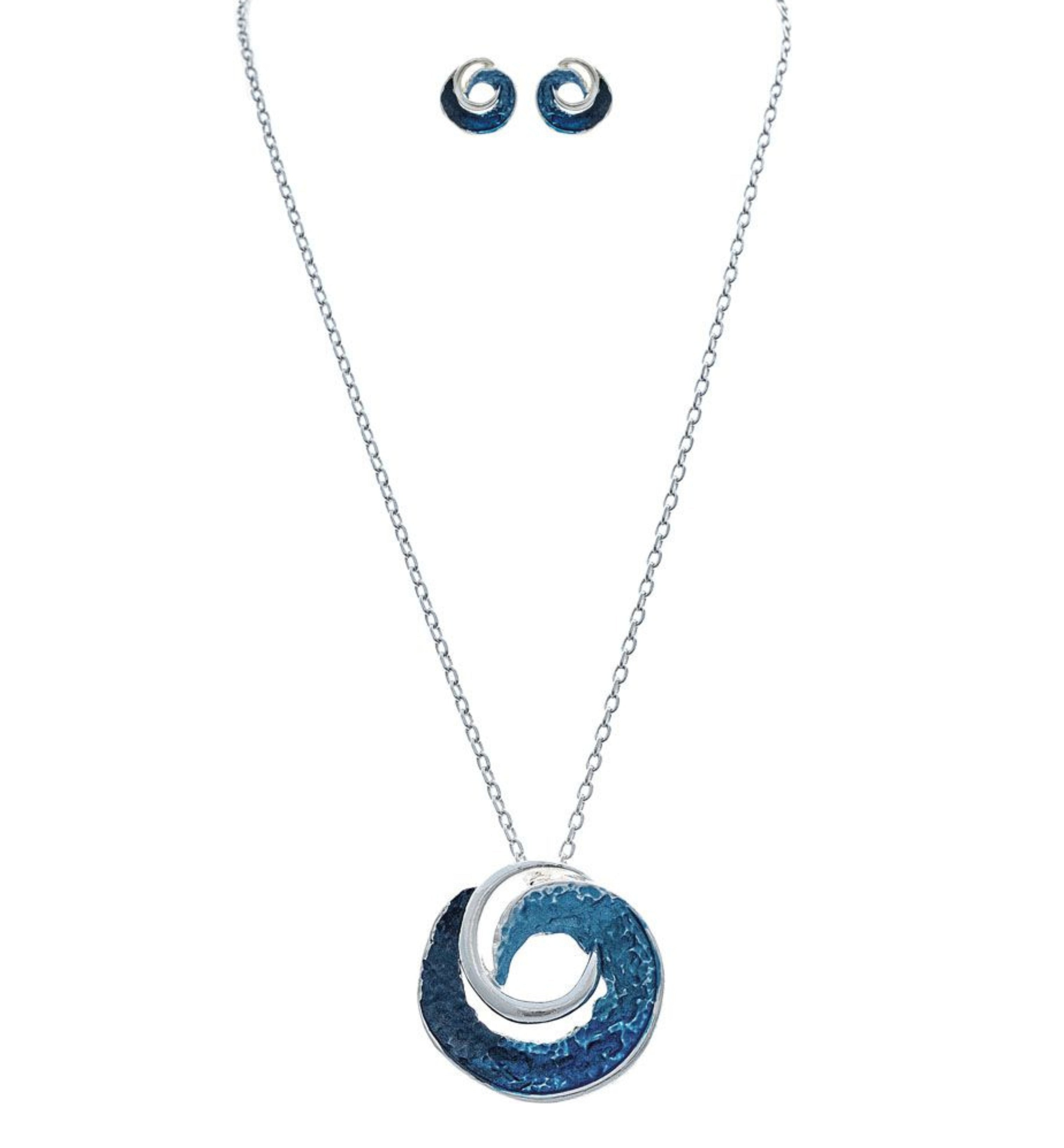 The A-Train Silver Textured Blue Curl Pendant Necklace Set features a round blue curl pendant and matching blue and silver swirl stud earrings, elegantly displayed on a white background.