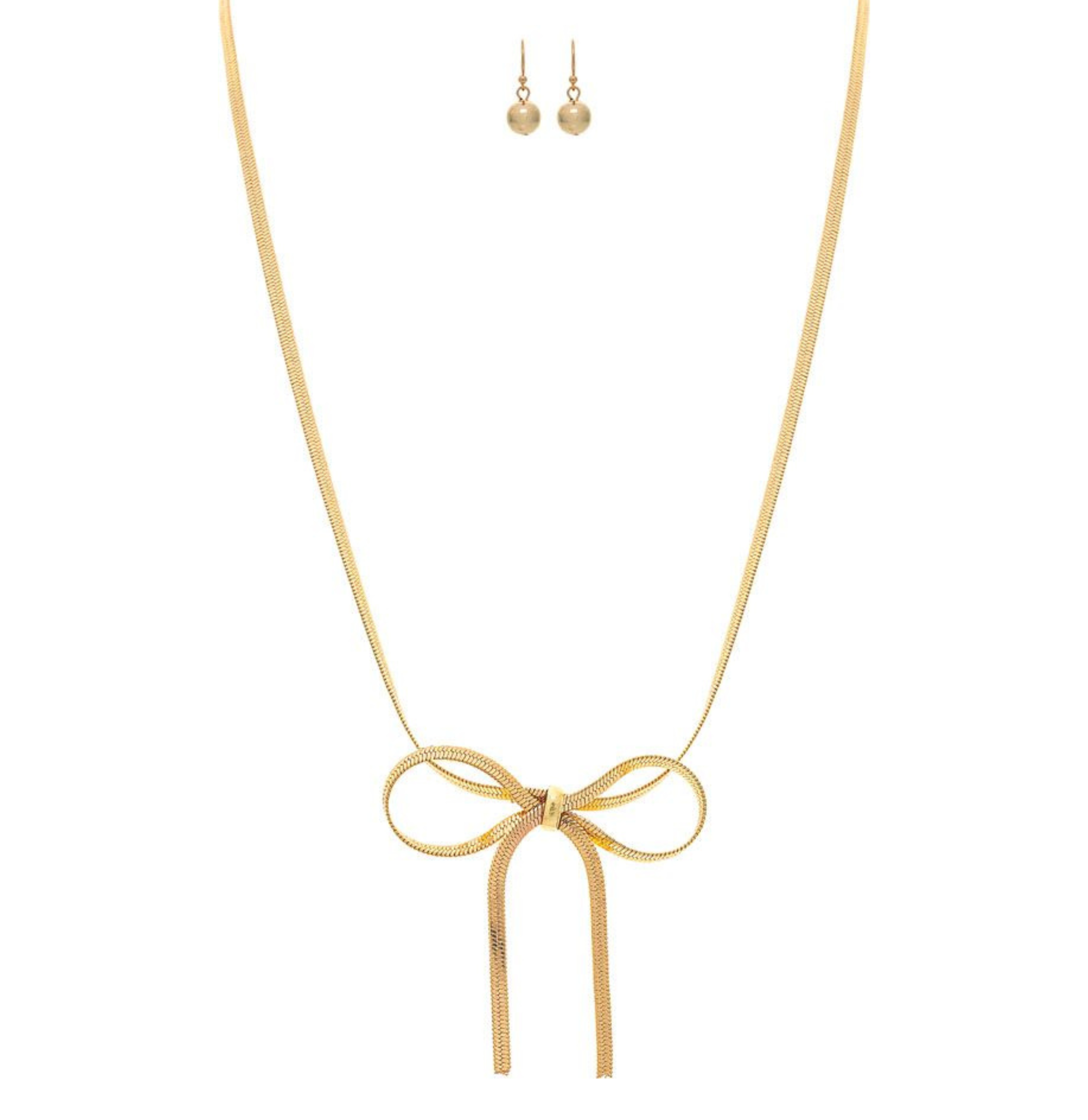 The A-Train Gold Herringbone Chain Bow Tie Necklace Set features a central ribbon bow design, matching gold stud earrings, and is crafted with mixed jeweler’s metals, shown on a white background.
