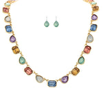 A-Train Gold Multi-Color Linked Gems Necklace Set features a necklace and matching green drop earrings, elegantly displayed on a white background.