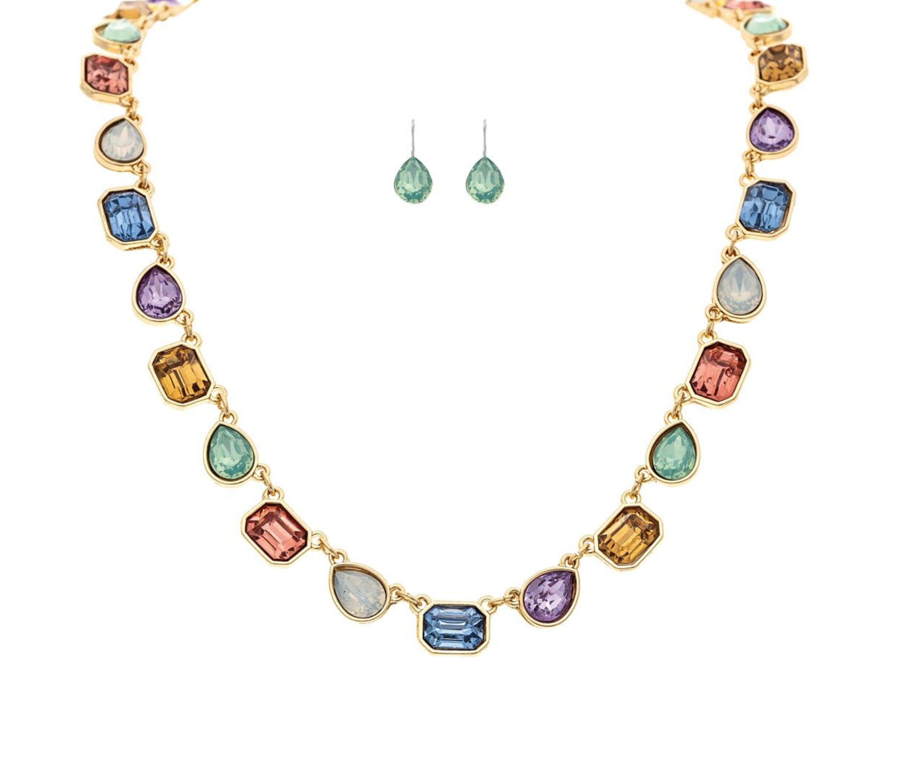 A-Train Gold Multi-Color Linked Gems Necklace Set features a necklace and matching green drop earrings, elegantly displayed on a white background.
