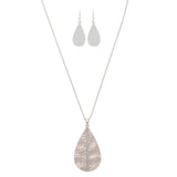 The A-Train Silver Cry Stripe Teardrop Necklace Set includes a long, textured pendant necklace with sparkling crystals and matching hammered teardrop dangle earrings.