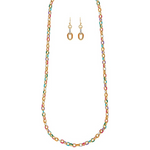 The A-Train Gold Multi Enamel Dipped Chain Necklace Set features a vibrant gold necklace with colorful links and matching hoop earrings, elegantly displayed on a white background.