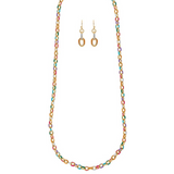 The A-Train Gold Multi Enamel Dipped Chain Necklace Set features a vibrant gold necklace with colorful links and matching hoop earrings, elegantly displayed on a white background.