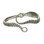 The A-Train Silver Octopus Hinge Cuff Bracelet features a detailed curled tentacle design with suction cup patterns and a secure clasp, displayed against a white background.