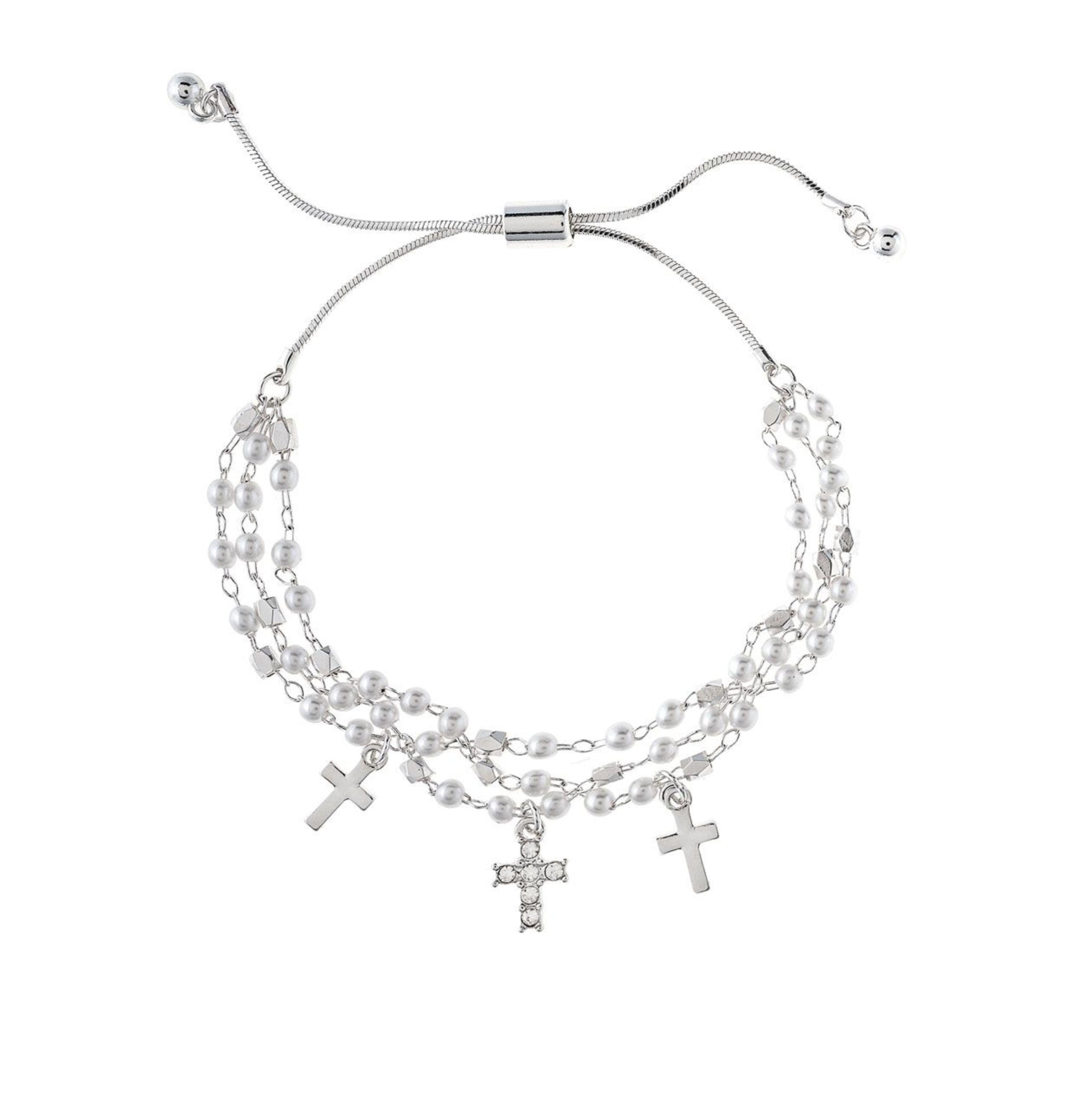 The A-Train Silver Faux Pearl Bead Cross Charm Bracelet features layered chains, three cross pendants, and faux pearl beads for an elegant look.