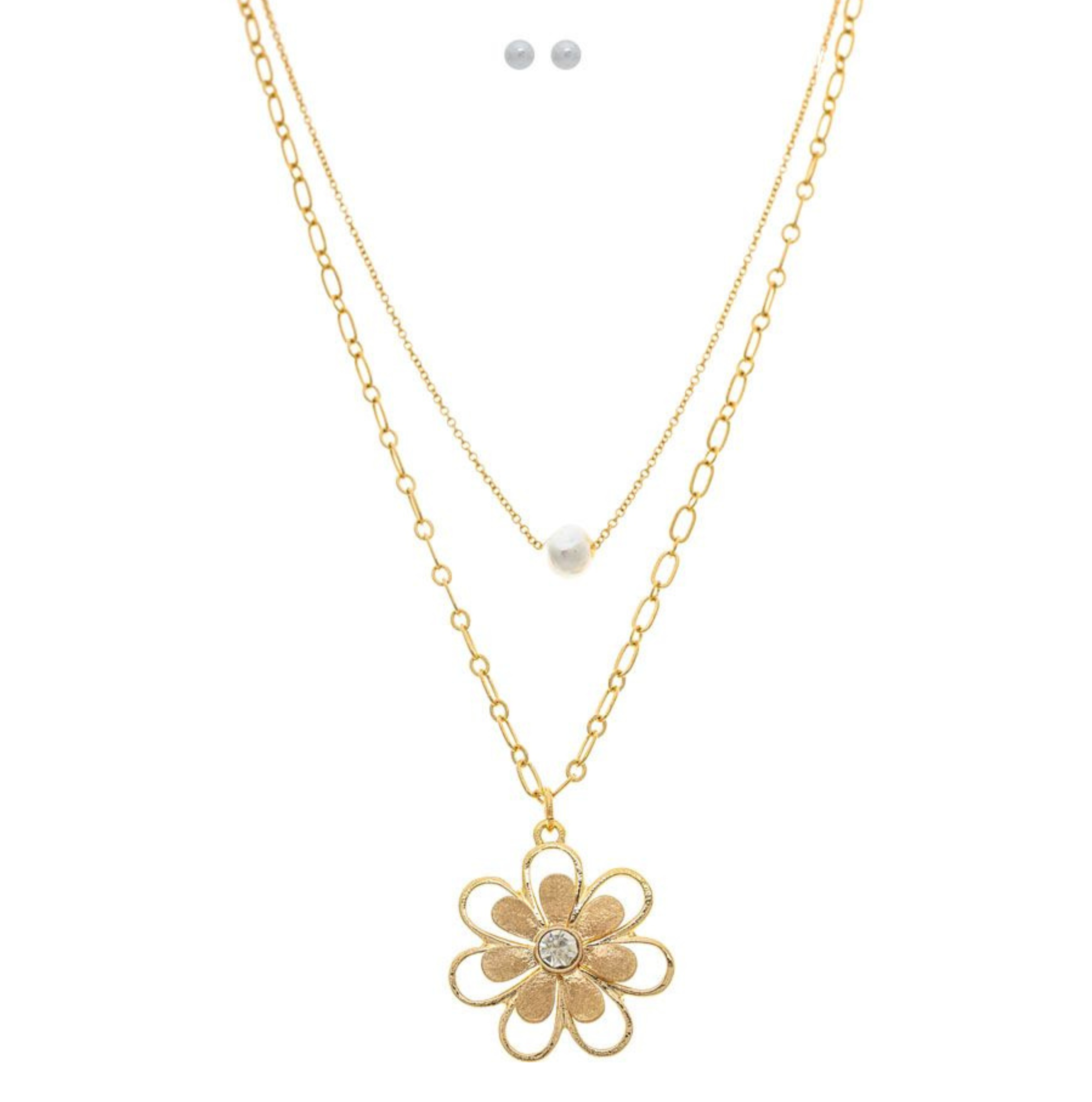 The A-Train Gold Freshwater Pearl Flower Blossom Layer Necklace Set includes a gold chain with a pearl accent, a gem-centered flower blossom necklace, and two small round stud earrings.