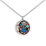The Luna w/Star Round Necklace by Firefly features a handcrafted round pendant with a silver crescent moon face on one side and vibrant designs of a sun, star, and gemstones on the other.