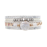 The A-Train Silver White Snake Fresh Water Pearl Rows Magnetic Bracelet features silver and white bands, braided details, metallic beads, and a large freshwater pearl centerpiece, displayed on a white background.