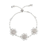 The A-Train Silver Three Flower Chain Link Slide Bracelet features three daisy-shaped charms on a chain and an adjustable sliding clasp with two small end beads for the perfect fit.