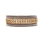The A-Train Gold Crystal Edge Heavy Chain Bracelet features a bold central chain-link design with intricate metallic patterns and sparkling crystal accents, all set against a white background.