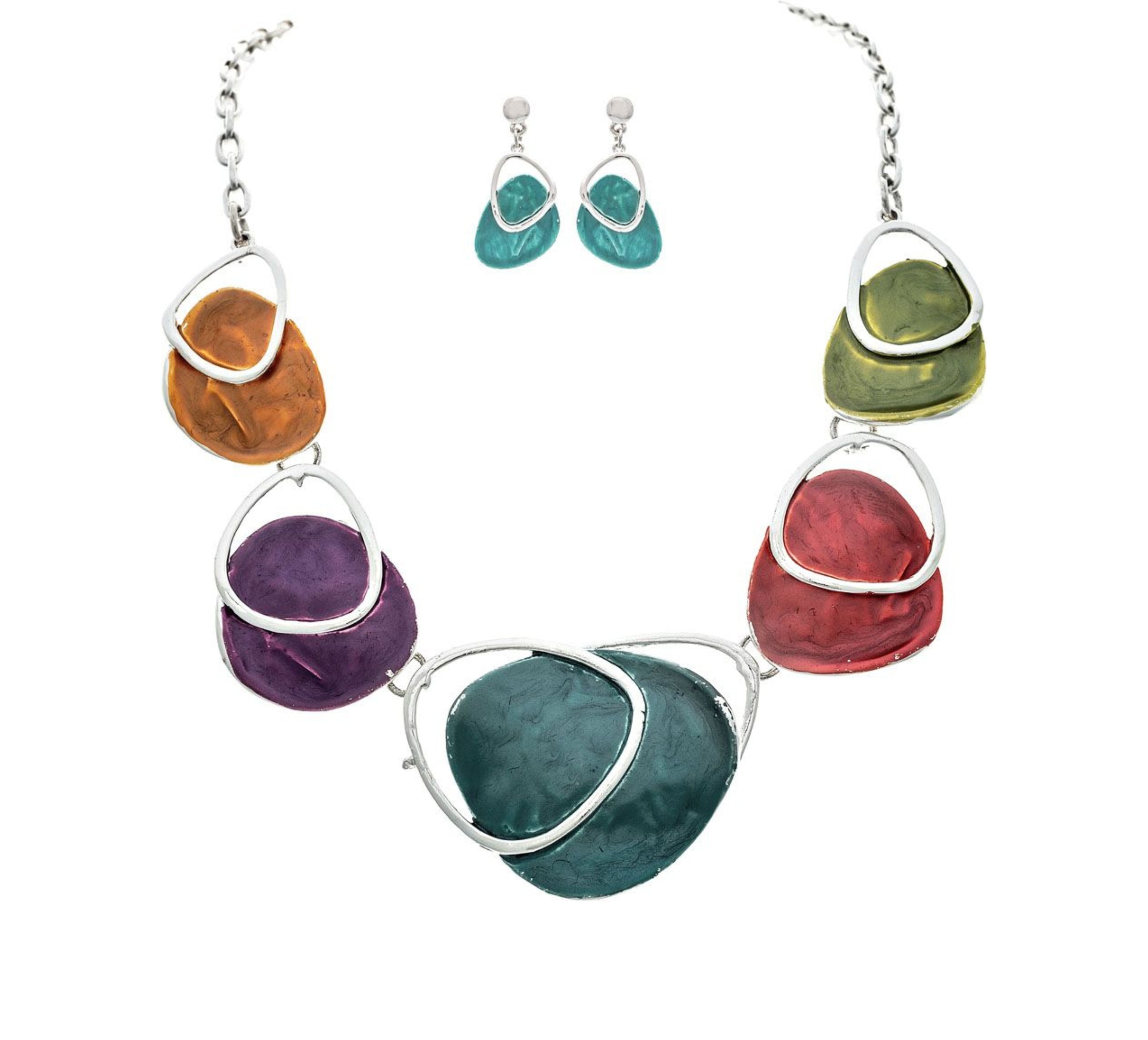 The A-Train Silver Multi Paint Palette Necklace Set features a silver chain with vibrant, irregular pendants crafted from quality mixed metals, plus coordinating teal dangle earrings with silver accents.