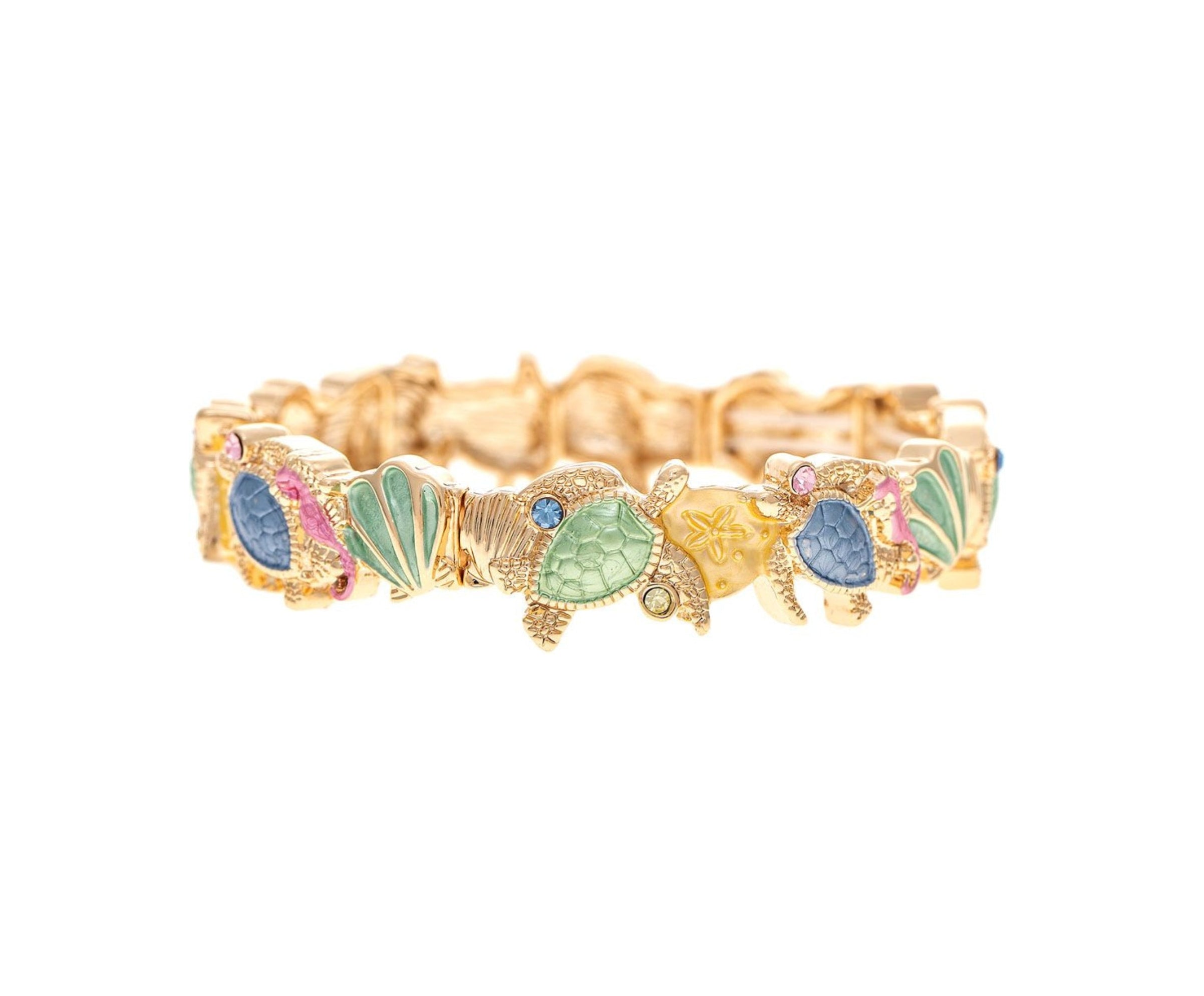 The A-Train Gold Multi-Color Turtles and Shells Beach Bracelet features jeweled blue, green, and pink accents on high-quality metal turtles, linked in a continuous design and shown on a white background.