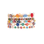 A-Trains Gold Multi-Color Mix Stone & Glass Bead Bracelet is a vibrant accessory featuring assorted shapes and sizes, showcased against a white background.