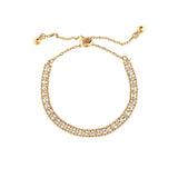 The A-Train Gold Crystal Row Slide Clasp Bracelet features two rows of sparkling clear stones and an adjustable sliding clasp with gold bead ends—an elegant accessory for any occasion.