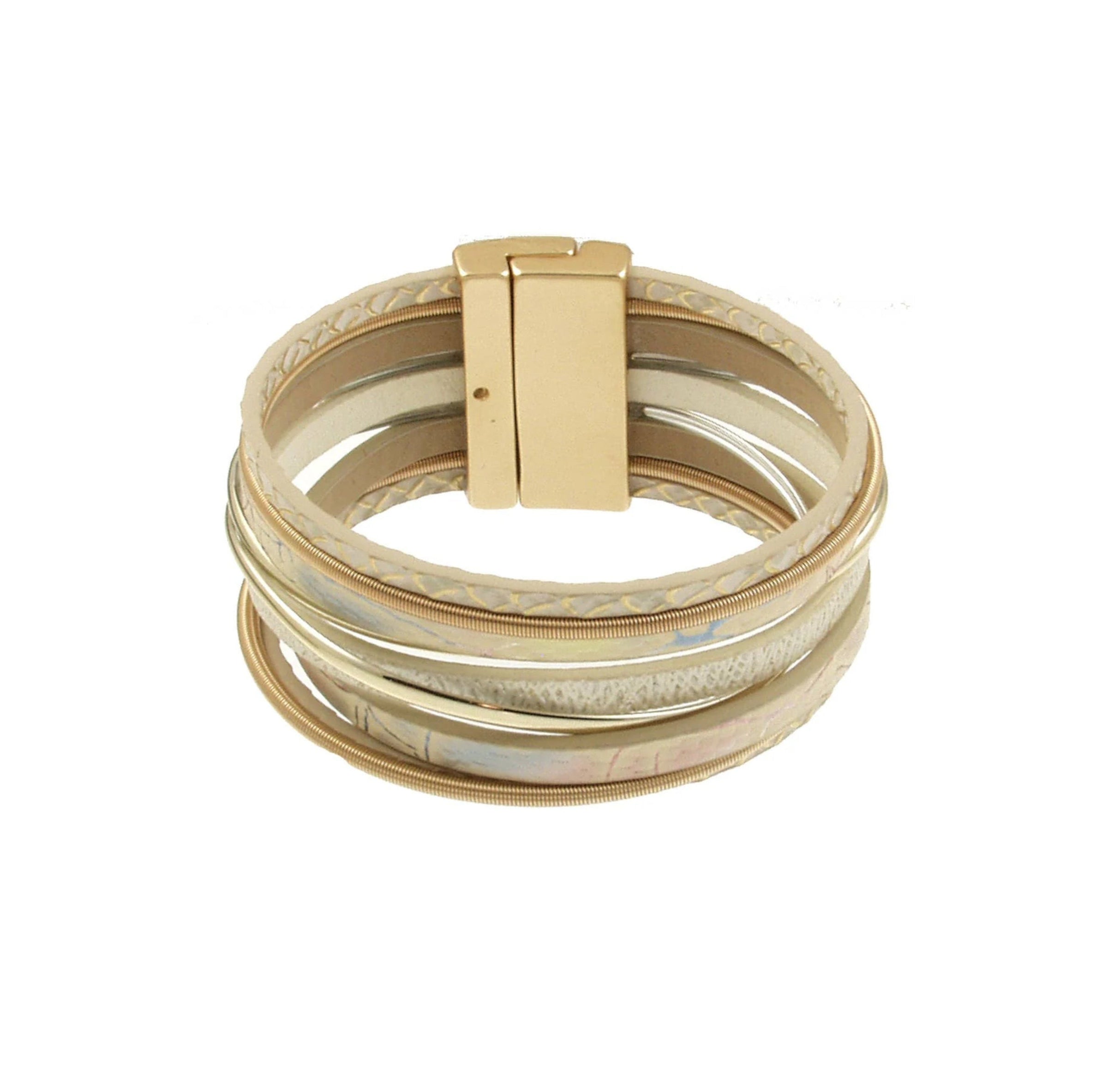 The Origin Light Matte Gold & White Magnetic Bracelet features overlapping gold and silver bands with a rectangular gold clasp, offering an elegant touch of sophistication to any outfit.