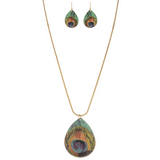 A-Train Gold Peacock Necklace Set: Elegant mixed-metal necklace and earrings with large teardrop pendants, showcasing vibrant green, blue, and bronze peacock feather patterns for a coordinated look.