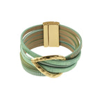 Origin’s Matt KC Gold/Aqua Print Hammered Teardrop Magnetic Bracelet features multiple light mint green leather straps, a shiny hammered teardrop centerpiece, and a rectangular gold magnetic clasp.