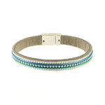 The Origin Matte Silver, Blue & Aqua Bead Center Magnetic Bracelet features elegant silver, turquoise, and blue beads in parallel rows with a silver clasp—an eye-catching accessory for any occasion.
