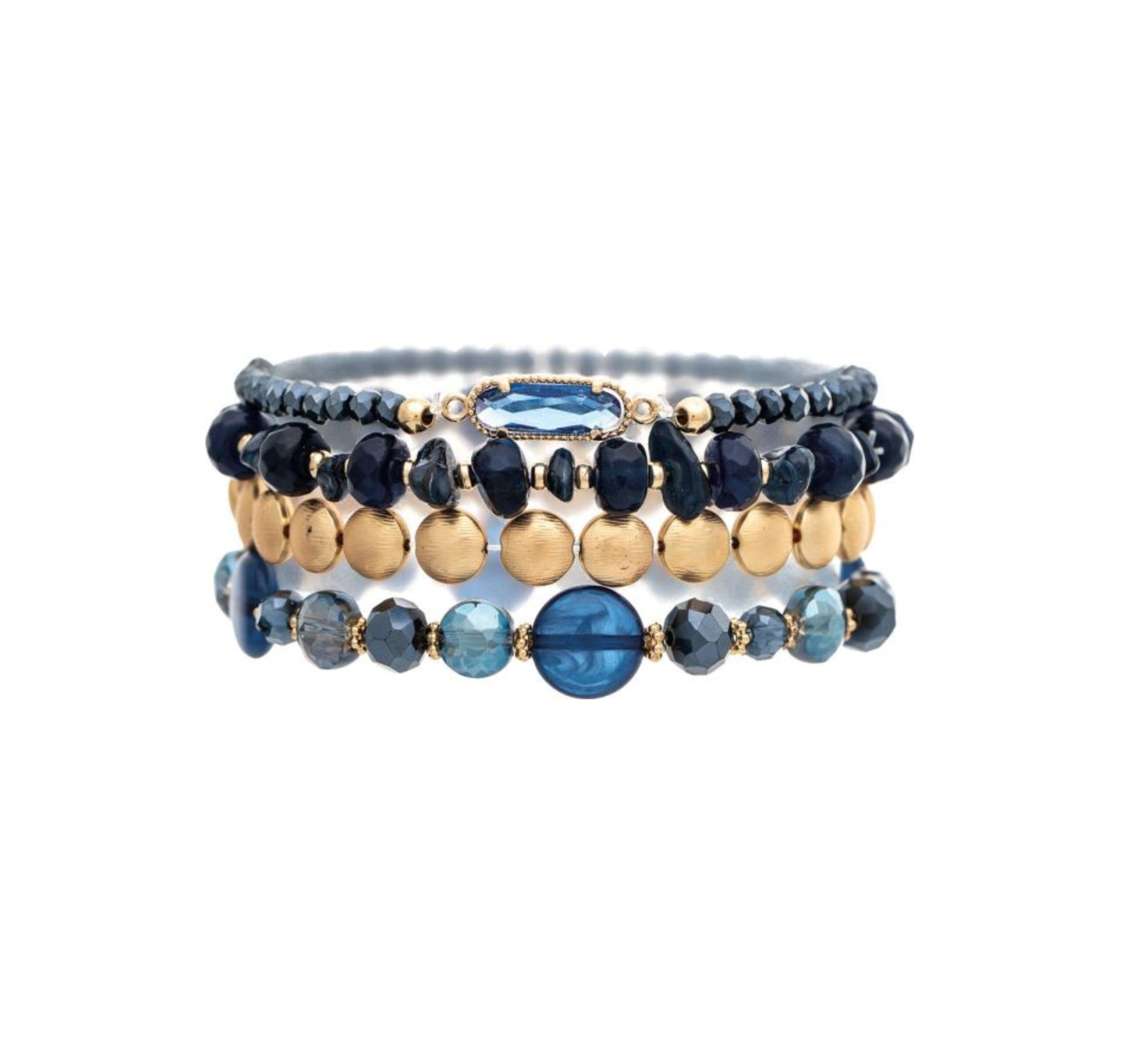 The A-Train Gold Dark Blue Stone Bead Glass 4 Pc Set Bracelet features stylish dark blue, gold, and light blue beads with a central oval gold dark blue stone accent, shown on a white background.